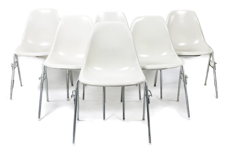 A Group of Six Charles and Ray Eames Chairs, Height 31: A Group of Six Charles and Ray Eames Chairs, each having a molded white fiberglass seat and raised on tubular legs. Height 31 inches. Property from the Collection of the Milwaukee Public Library, Milw