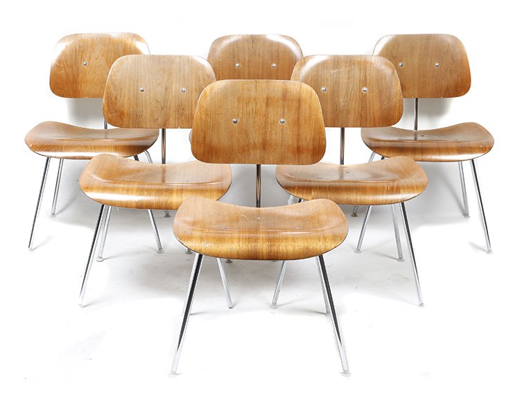 Six Charles and Ray Eames DCM Chairs, for Herman: Six Charles and Ray Eames DCM Chairs, for Herman Miller, each having a laminated wood back and seat, raised on four metal legs. Height 30 1/2 inches. Property from the Collection of the Milwaukee Publ