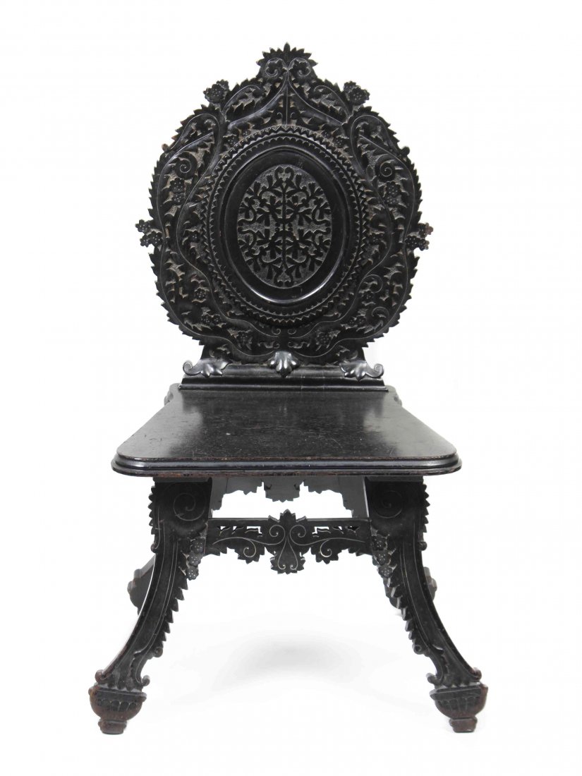 A Persian Hall Chair, Height 41 1/4 x width 25 1/4 x: A Persian Hall Chair, having carved back and plank seat. Height 41 1/4 x width 25 1/4 x depth 19 1/2 inches.