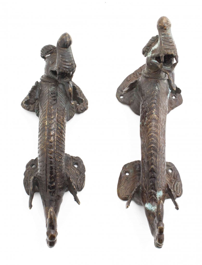 A Pair of Tibetan Metal Door Handles, Length 10 1/4: A Pair of Tibetan Metal Door Handles, in the shape of dragons. Length 10 1/4 inches.