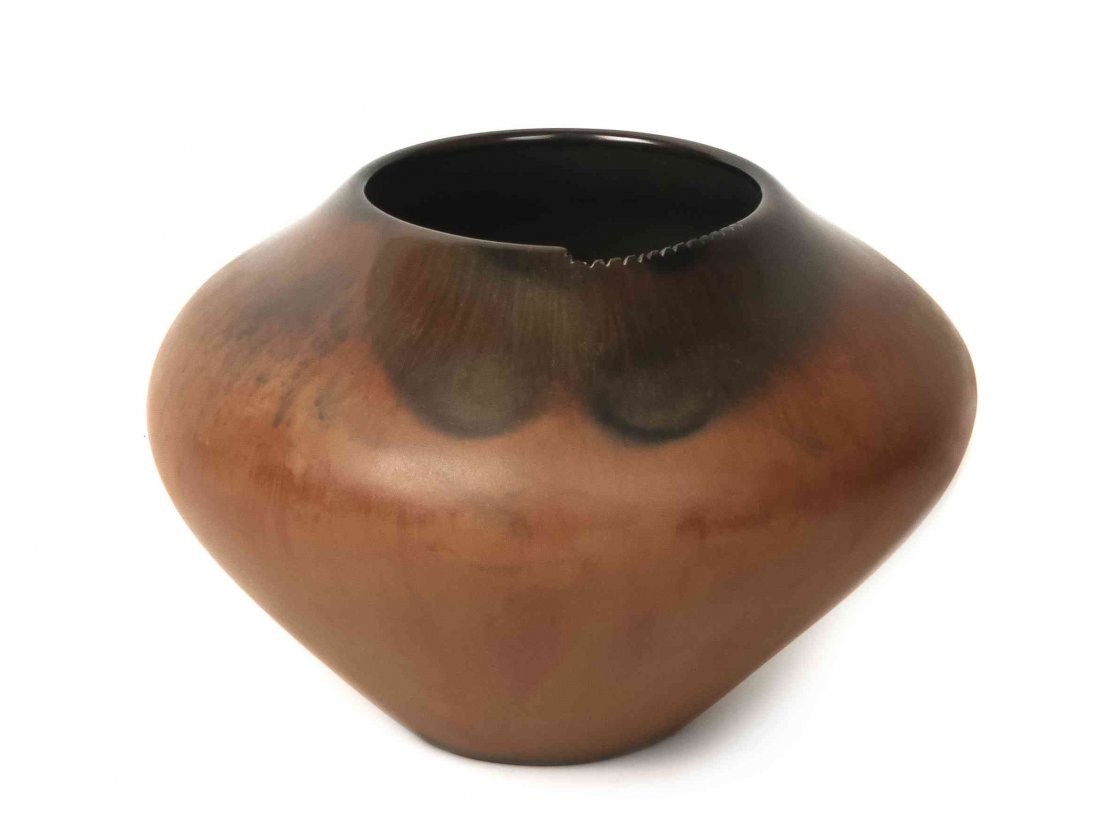 A Santa Clara Polished Redware Olla, Jody Folwell,: A Santa Clara Polished Redware Olla, Jody Folwell, having fire clouds and incised designs along rim, signed Jody. Height 8 x diameter 11 1/2 inches.