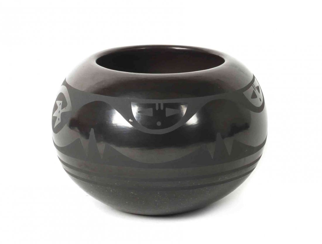 A San Ildefonso Stone Polished Blackware Pottery Bowl,: A San Ildefonso Stone Polished Blackware Pottery Bowl, Martha Appleleaf, having avanyu decoration on matte ground, signed Martha Appleleaf. Height 3 1/2 x diameter 5 1/4 inches.