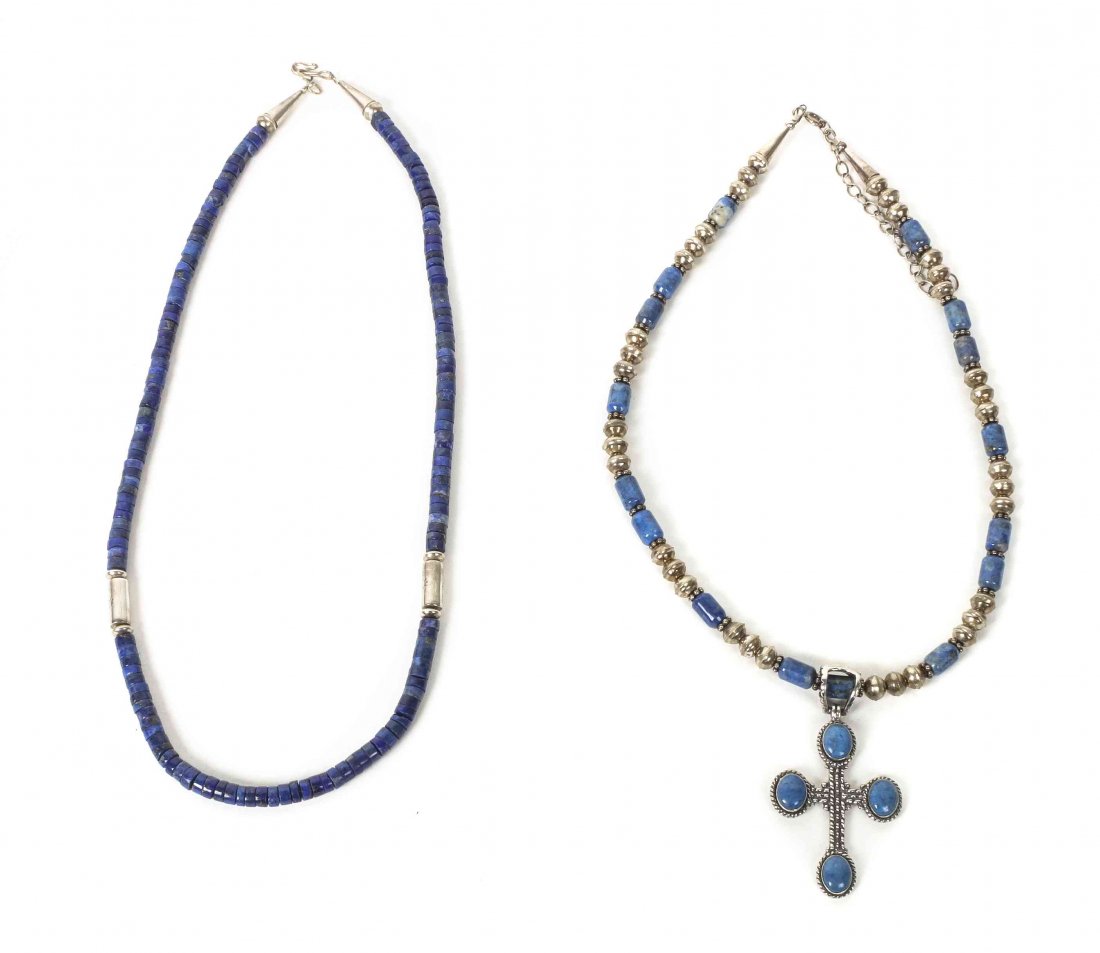 Two Southwestern Lapis and Silver Bead Necklaces,: Two Southwestern Lapis and Silver Bead Necklaces, having a sand cast cross pendant with lapis cabochons at terminals, marked QT 925, together with a lapis disk bead necklace with two silver spacers, b
