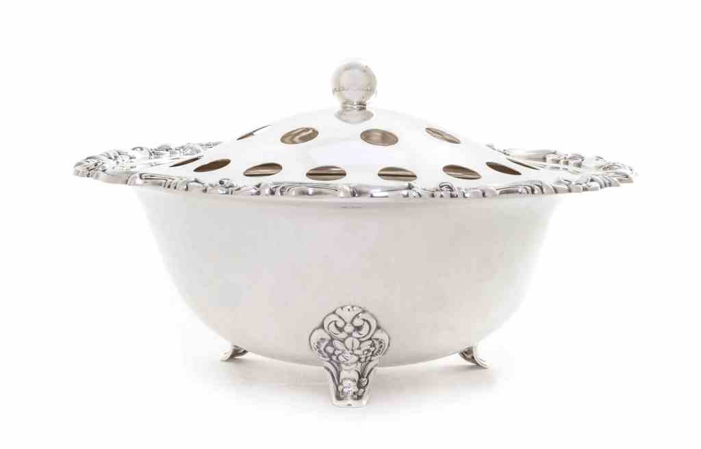 A German Silver Bowl and Cover, Gebruder Kuhn,: A German Silver Bowl and Cover, Gebruder Kuhn, Schwabisch Gmund, First Half 20th Century, the deep circular bowl with scroll and flower rim, raised on conforming bracket supports, the domed cover with
