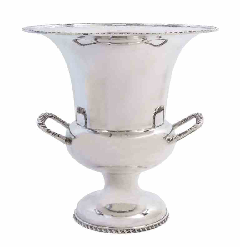 A Mexican Silver Wine Cooler, Juventino Lopez Reyers,: A Mexican Silver Wine Cooler, Juventino Lopez Reyers, Mexico City, Mid 20th Century, of campana form with gadrooned borders and matching loop handles, marked on base; 56 ozt. Height 11 inches.