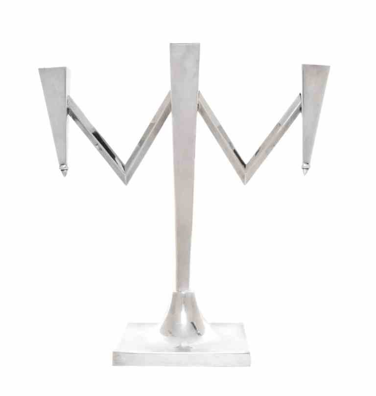 A Mexican Silver Three-Light Candelabra, Maker's Mark: A Mexican Silver Three-Light Candelabra, Maker's Mark LMM, Second Half 20th Century, the square base rising to a tapered rectangular stem fitted with recessed sconces, the angular branches with triang