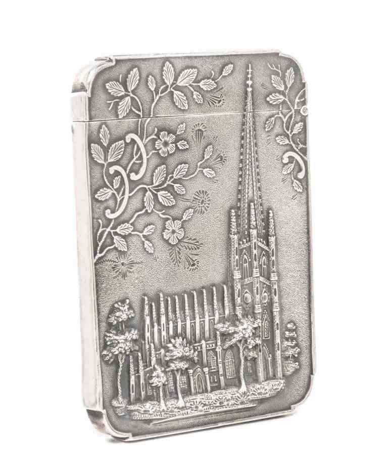 An American Silver Card Case, Leonard & Wilson,: An American Silver Card Case, Leonard & Wilson, Philadelphia, Mid 19th Century, rectangular with shaped corners, one side embossed and chased with Trinity Church in lower Manhattan and sprays of prunu