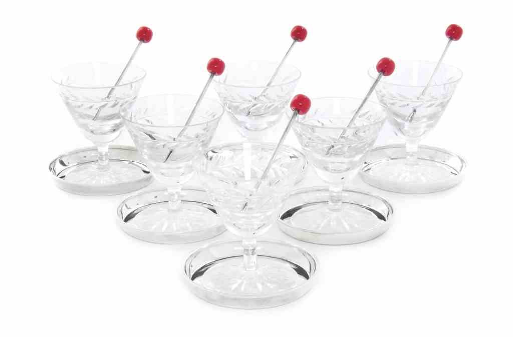 An English Silver and Cut-Glass Martini Drinking Set,: An English Silver and Cut-Glass Martini Drinking Set, Birmingham 1959, Retailed by Garrard, London, comprising six circular coasters, six martini glasses with running foliate rims, and six olive picks