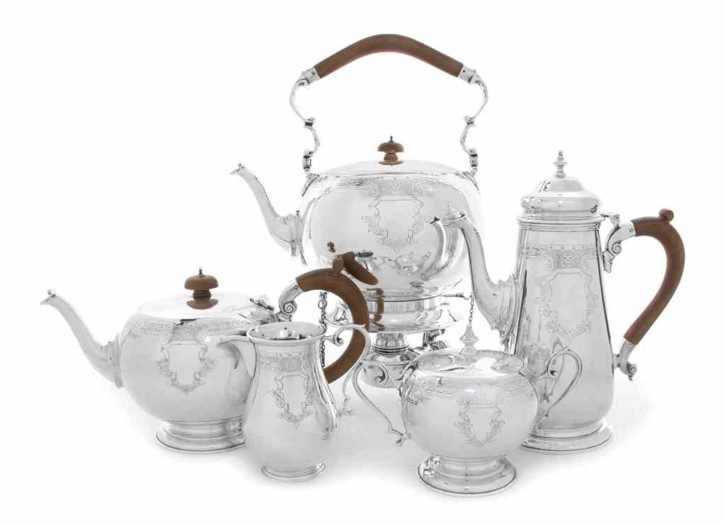 An English Silver Five-Piece Tea and Coffee Service,: An English Silver Five-Piece Tea and Coffee Service, Nayler Bros., London, 1940, comprising a teapot, coffee pot, kettle on lampstand, creamer and covered sugar bowl, in George II style, engraved with