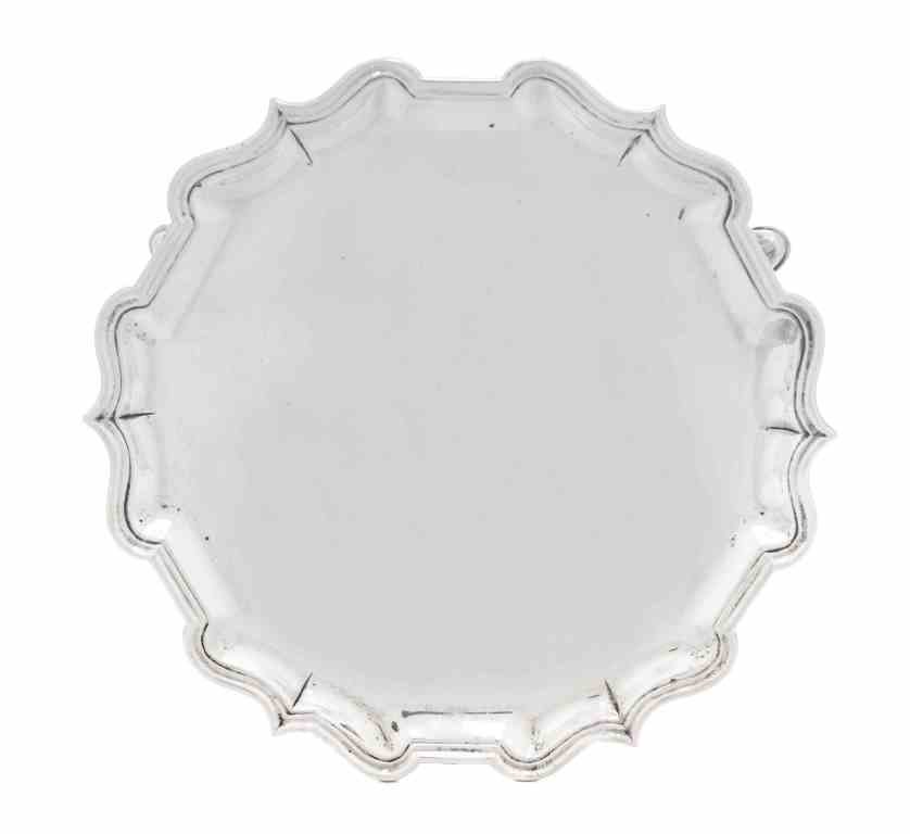 A George II Silver Salver, Joseph Sanders, London,: A George II Silver Salver, Joseph Sanders, London, 1736, shaped circular with molded rim, raised on three scroll supports terminating in pad feet, underside engraved with contemporary block initials R