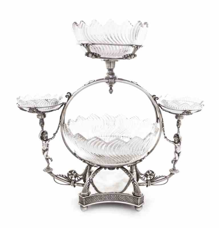 An American Silver-Plate and Cut Glass Epergne, Meriden: An American Silver-Plate and Cut Glass Epergne, Meriden Britannia Co., Meriden, CT, Late 19th Century, in Aesthetic taste, the base raised on ball feet and with stylized floral borders, rising to four