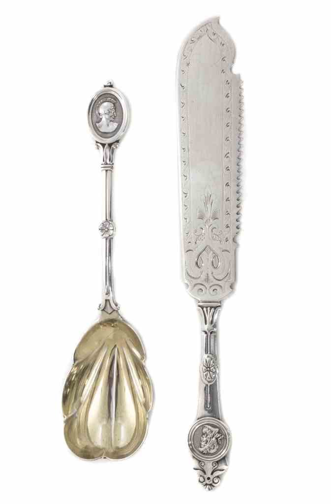 An American Silver Cake Knife and Berry Spoon, Circa: An American Silver Cake Knife and Berry Spoon, Circa 1865, both Medallion pattern, the knife by Gorham Mfg. Co., Providence, RI, the spoon with gilt bowl, John Wendt, New York, NY; 6 ozt 3 dwt. Lengt