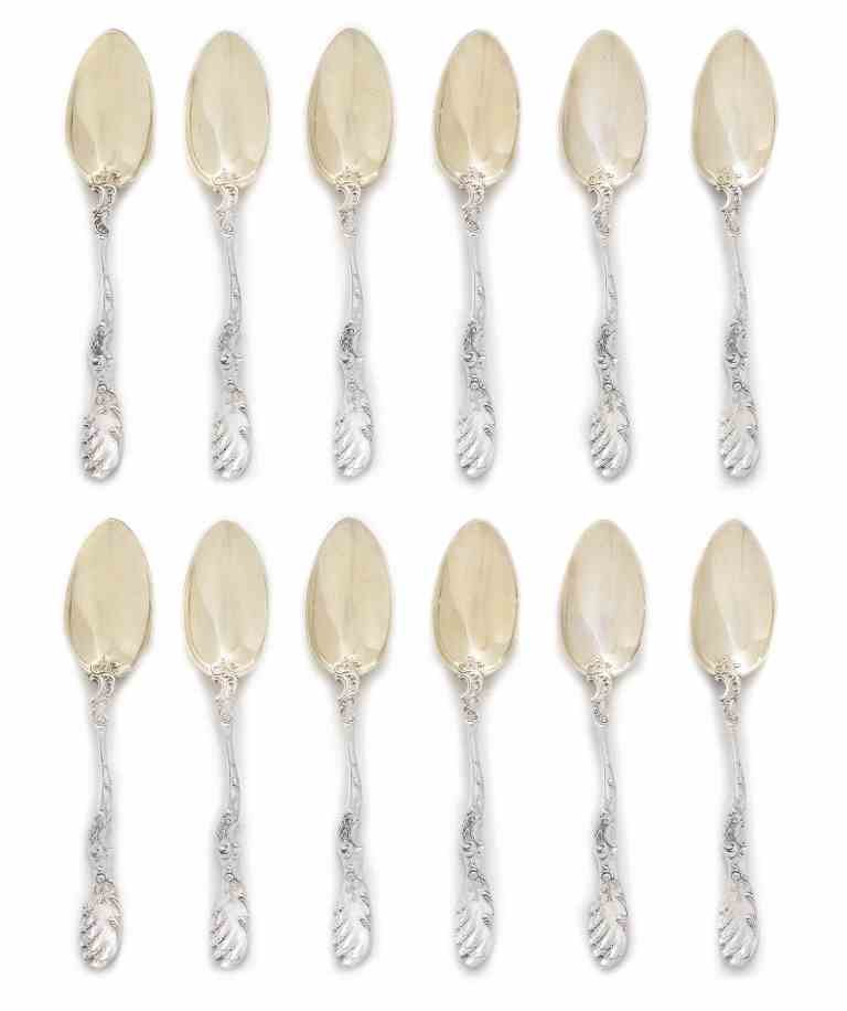 A Set of Twelve German Parcel-Gilt Silver Teaspoons,: A Set of Twelve German Parcel-Gilt Silver Teaspoons, Bruckmann & Sohne, Early 20th Century, with gilt bowls, the handles decorated with rocaille and terminating in wings, marked on handle reverse; 8 o