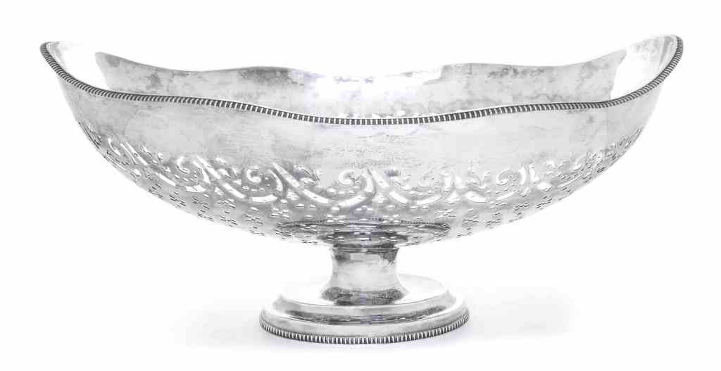 A Silver Large Centerpiece Bowl, Length 17 7/8 inches.: A Silver Large Centerpiece Bowl, oval with undulating rim and gadrooned borders, pierced with flowers and scrolls, underside with transposed marks for Francis Butty & Nicholas Dumee, London, 1770; 45 