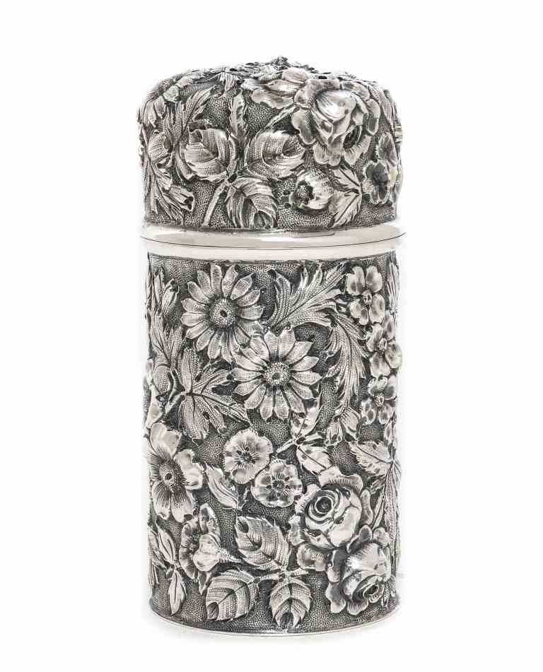 An American Silver Sugar Caster, Jenkins & Jenkins: An American Silver Sugar Caster, Jenkins & Jenkins Inc., Baltimore, MD, Circa 1910, cylindrical with slip-lock cover, densely chased overall with flowers and foliage against a matted ground, marked on