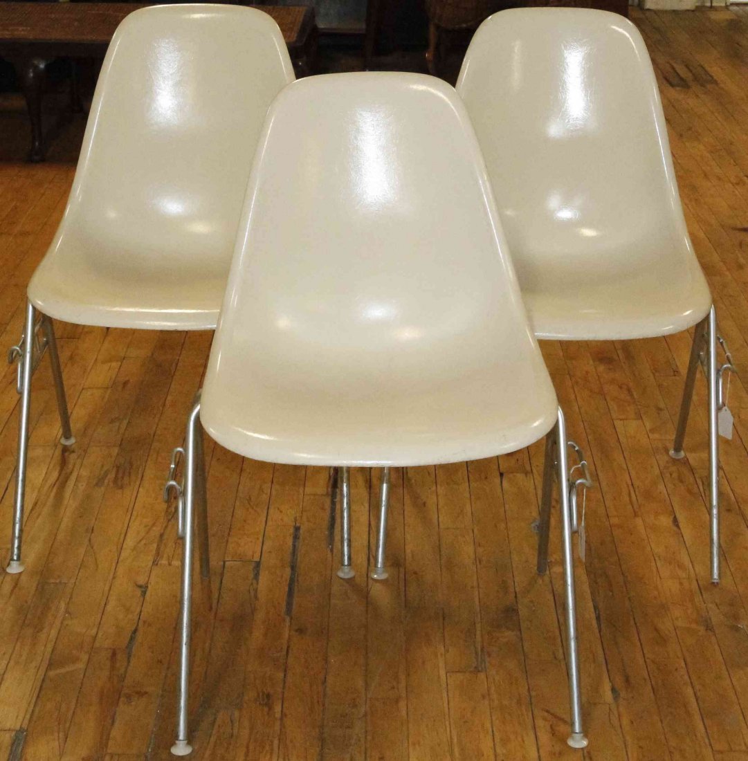 A Group of Six Charles and Ray Eames Chairs, Height 31: A Group of Six Charles and Ray Eames Chairs, white and raised on tubular legs. Height 31 inches. Property from the Collection of the Milwaukee Public Library, Milwaukee Wisconsin