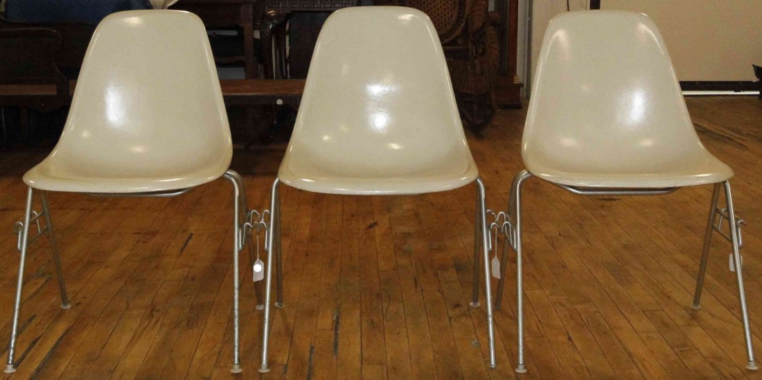 A Group of Six Charles and Ray Eames Chairs, Height 31: A Group of Six Charles and Ray Eames Chairs, white and raised on tubular legs. Height 31 inches. Property from the Collection of the Milwaukee Public Library, Milwaukee Wisconsin