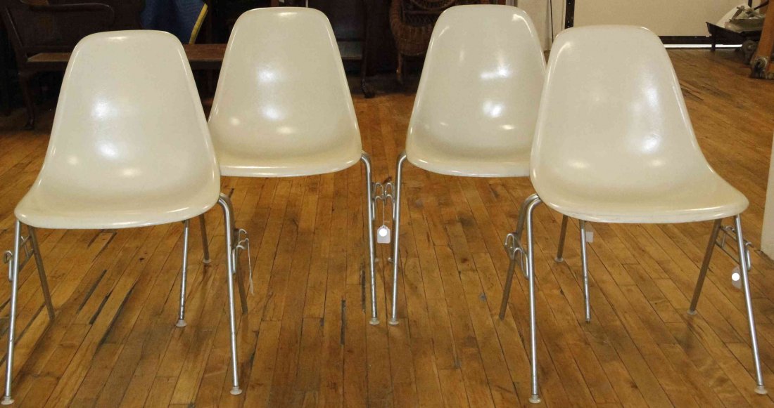 A Group of Four Charles and Ray Eames Chairs, Height 31: A Group of Four Charles and Ray Eames Chairs, white and raised on tubular legs. Height 31 inches. Property from the Collection of the Milwaukee Public Library, Milwaukee Wisconsin