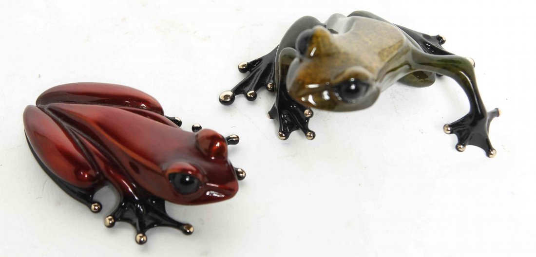 Two Patinated Bronze Frogs, Tim Cotterill, Height of: Two Patinated Bronze Frogs, Tim Cotterill, each depicted on all fours. Height of largest 2 1/2 inches. Property from the Estate of Louis M. and Linda M. Byron, Tucson, Arizona