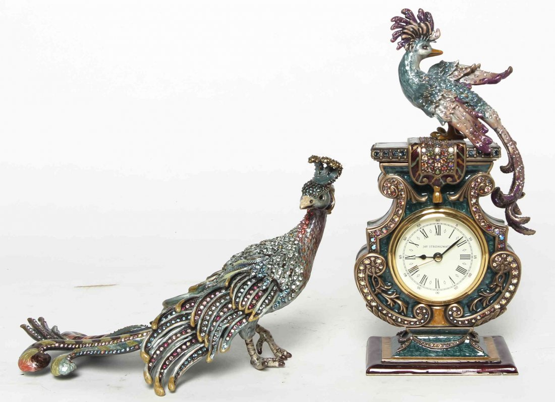 A Jay Strongwater Clock with Peacock Adornment, Height: A Jay Strongwater Clock with Peacock Adornment, together with another Peacock figurine. Height 9 inches. Property from the Estate of Louis M. and Linda M. Byron, Tucson, Arizona