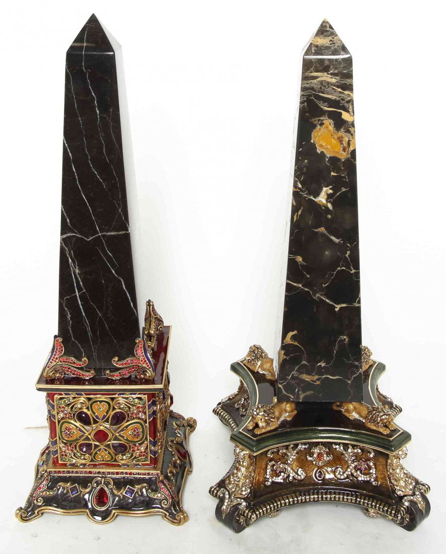 Two Jay Strongwater Obelisks, Height 17 1/2 inches.: Two Jay Strongwater Obelisks, each with varying color marble over the enamel base. Height 17 1/2 inches. Property from the Estate of Louis M. and Linda M. Byron, Tucson, Arizona