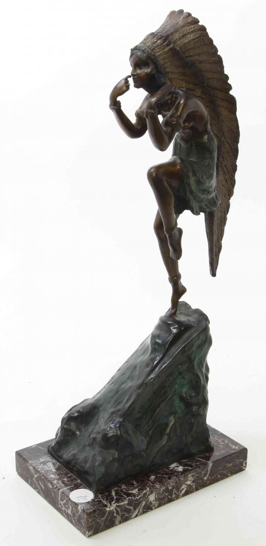 A Bronze Statue, after Demetre Chiparus, Height of: A Bronze Statue, after Demetre Chiparus, depicting a Native American maiden in full headdress, set on a marble plinth base. Height of bronze 19 1/2 inches. Property from the Collection of a Lady, Oak