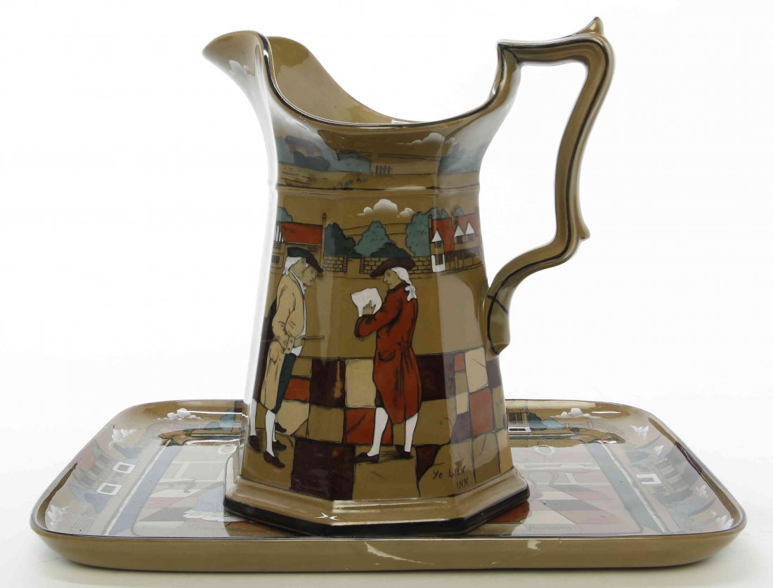 Two Deldare Pottery Articles, Buffalo Pottery, Height: Two Deldare Pottery Articles, Buffalo Pottery, comprising a pitcher and a tray, each with figural decoration. Height of first 9 3/4 inches. Property from the Collection of a Lady, Oak Brook, Illinois