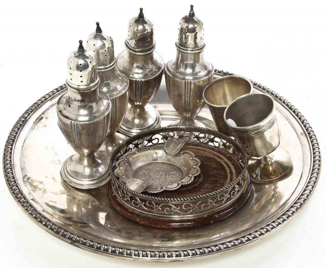 A Collection of Continental and American Silver Table: A Collection of Continental and American Silver Table Articles, comprising a Continental silver mounted coaster, four casters, two cordials, a circular dish and a Mexican ash receiver; 18 ozt 18 dwt n