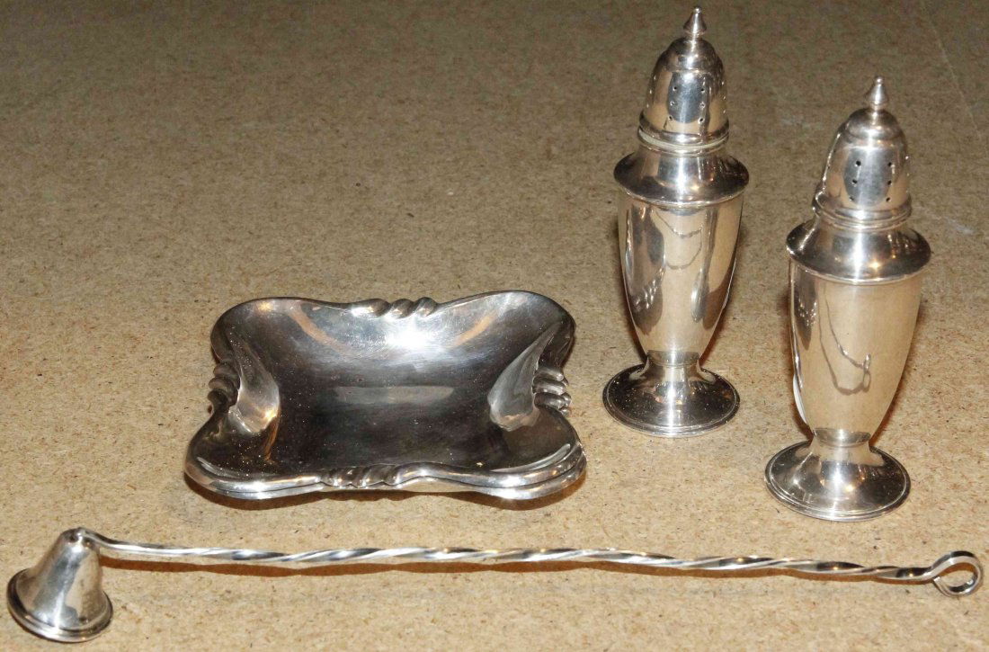 A Collection of American Silver Table Articles, Height: A Collection of American Silver Table Articles, comprising two shaped square ash receivers, a candle snuff and a pair of casters, each marked; 6 ozt 18 dwt. Height of casters 5 inches. Property from t