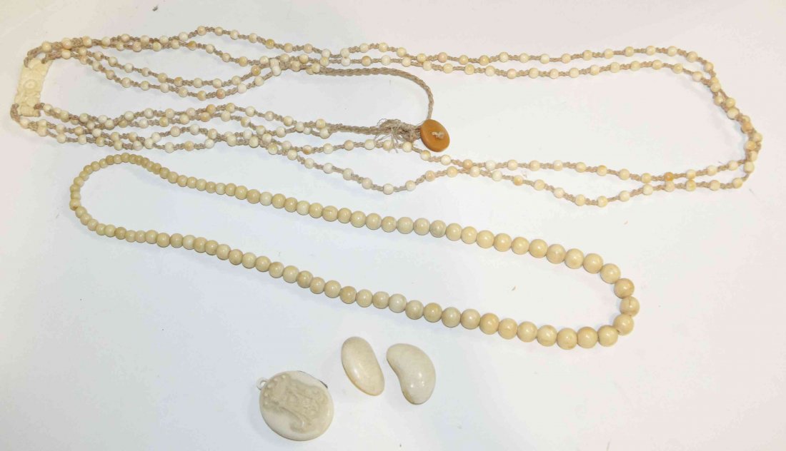 A Collection of Ivory Articles, Length of longest 22: A Collection of Ivory Articles, comprising two beaded necklaces, a pair of earclips and a monogrammed locket. Length of longest 22 1/2 inches.