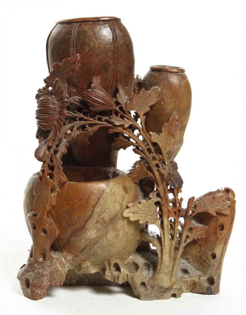 A Carved Soapstone Triple Spill Vase, Height of first 7: A Carved Soapstone Triple Spill Vase, with floral decoration, together with a soapstone spill vase raised on a wood stand. Height of first 7 1/2 inches.