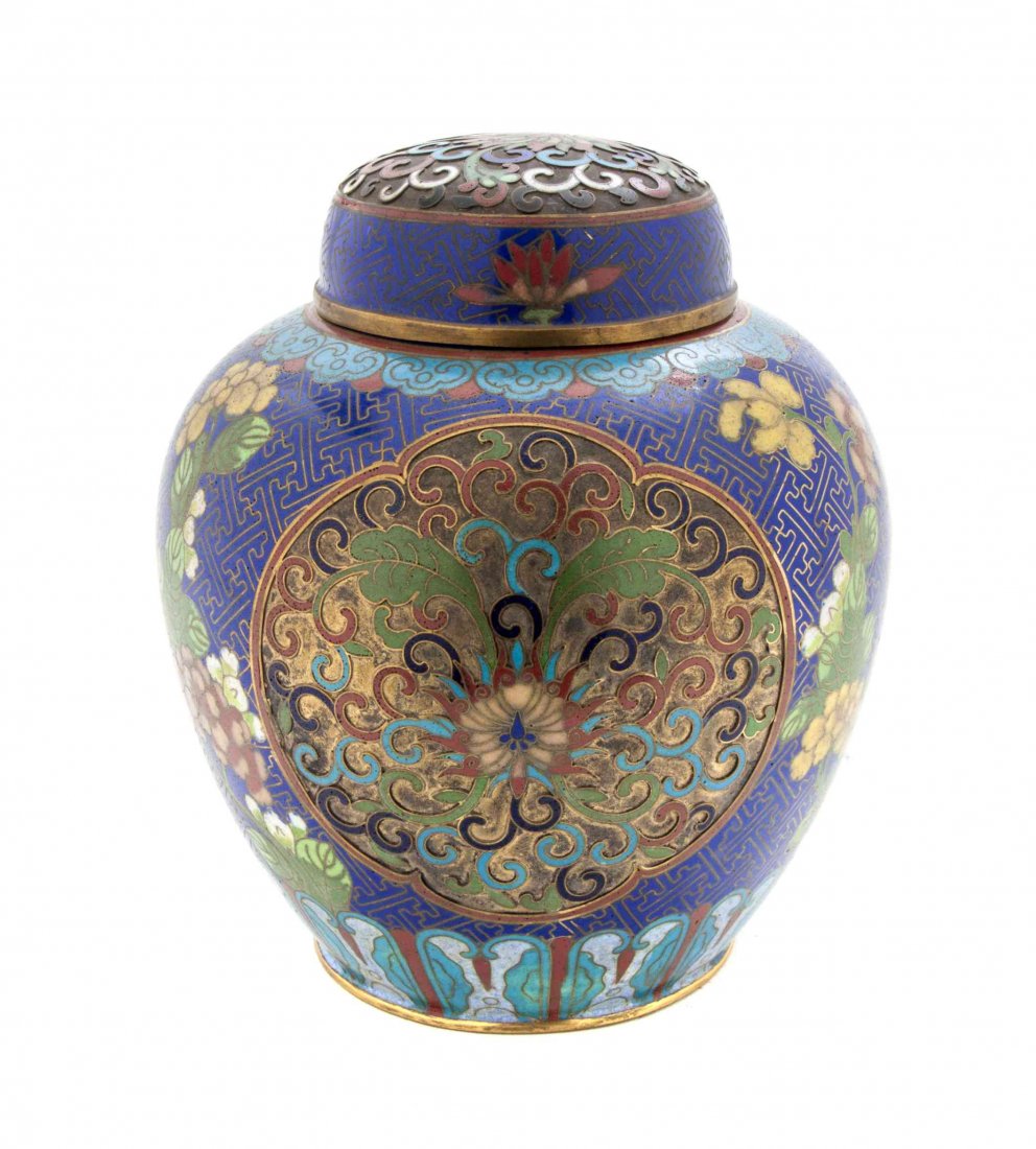A Chinese Cloisonne Enamel Covered Ginger Jar, Height 7: A Chinese Cloisonne Enamel Covered Ginger Jar, having scrolling lotus reserves on a geometric ground, with a lappet form lower border. Height 7 1/4 inches.