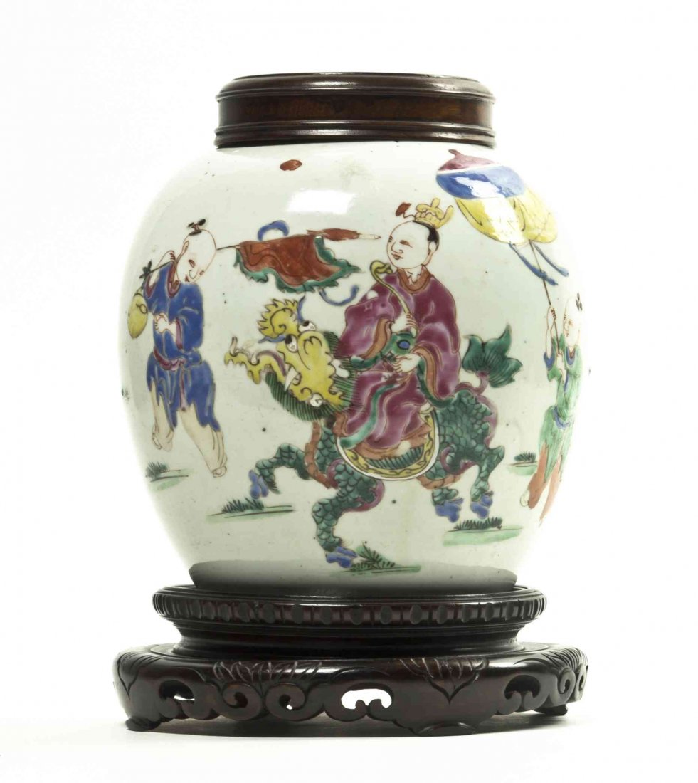 A Chinese Polychrome Enamel Porcelain Ginger Jar,: A Chinese Polychrome Enamel Porcelain Ginger Jar, with carved wood lid and stand. Height of jar with lid 8 1/4 inches.