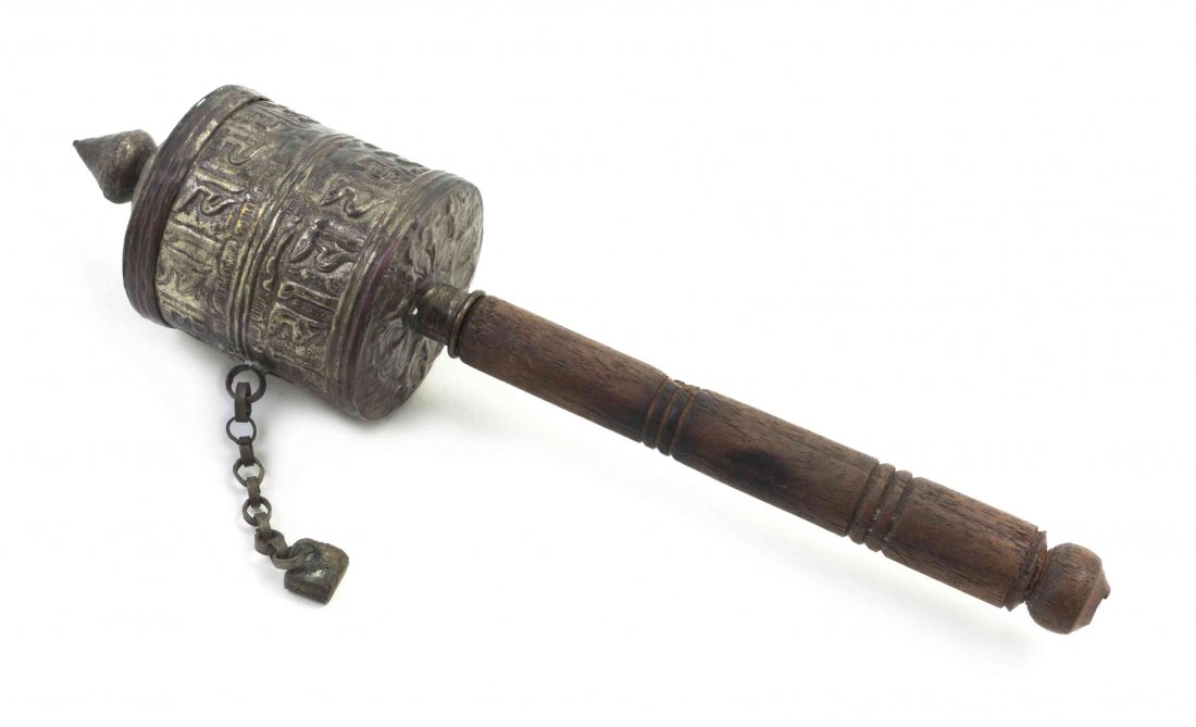 A Tibetan Prayer Wheel, Height overall 9 1/2 inches.: A Tibetan Prayer Wheel, of typical form on a wooden handle. Height overall 9 1/2 inches. Property from the Collection of Dr. J. Don Nelson, Fargo, North Dakota Provenance: Purchased circa 1950