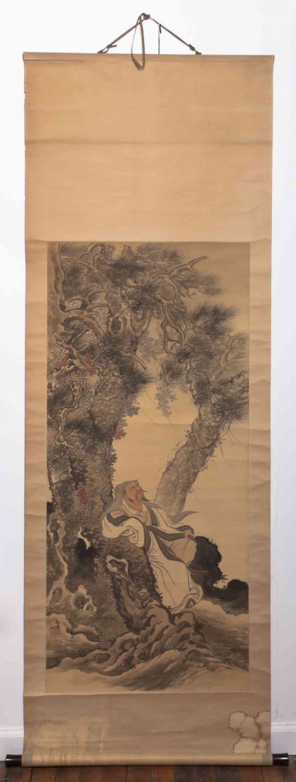 A Japanese Painting on Silk, Height 45 x width 20 1/4: A Japanese Painting on Silk, depicting a sage seated in pleated robes at the foot of a knotted pine tree, with gnarled branches and roots, signed with one seal to the lower left register, mounted as a