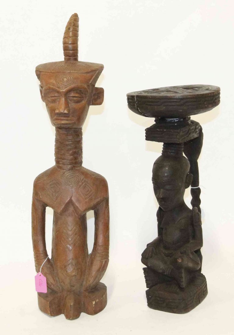Two African Carved Wood Figures, Height of tallest 24: Two African Carved Wood Figures, comprising a Ndengese figure of a kneeling man in a flat headdress and a Kuba King Shamba stool in the form of a seated woman. Height of tallest 24 1/2 inches. Propert