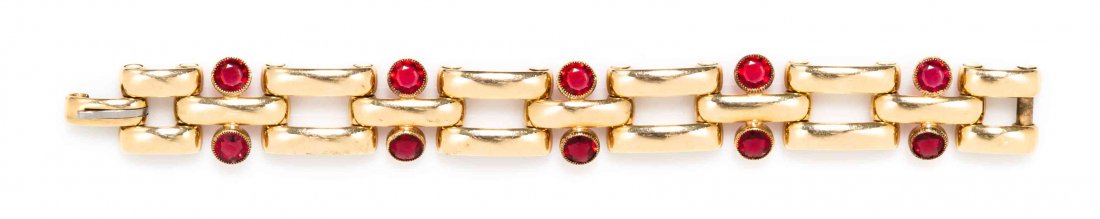 A Retro 14 Karat Yellow Gold and Paste Bracelet,: A Retro 14 Karat Yellow Gold and Paste Bracelet, Simmons, in a spaced brick link design punctuated with pairs of bezel set round red paste. Stamp: Simmons. 27.90 dwts.