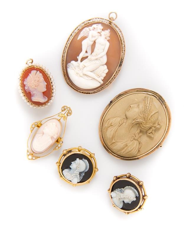 A Collection of Cameo Brooches, Circa 1870-1930,: A Collection of Cameo Brooches, Circa 1870-1930, in gold and gold-filled settings, depicting Neoclassical motifs carved in lava, shell, black and white onyx and orange and white agate.