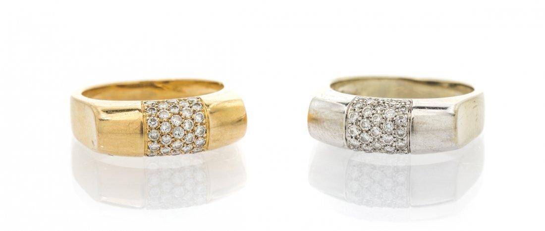 A Pair of 18 Karat Gold and Diamond Stacking Rings,: A Pair of 18 Karat Gold and Diamond Stacking Rings, consisting of a white gold ring and a rose ring containing 66 round brilliant cut diamonds weighing approximately 0.66 carat total. Stamp: HAMI. 8.9