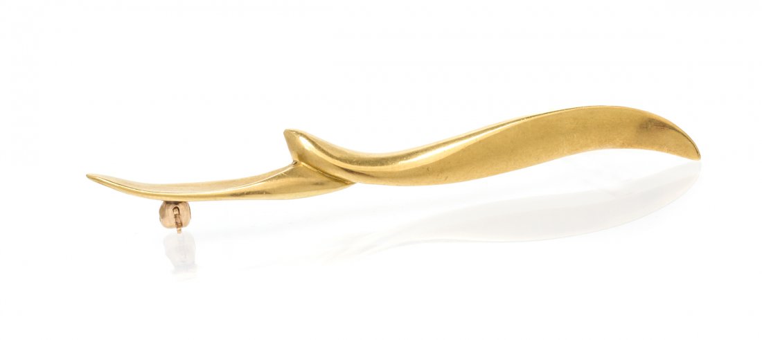 An 18 Karat Yellow Gold Brooch, Angela Cummings, Circa: An 18 Karat Yellow Gold Brooch, Angela Cummings, Circa 1984, in a stylized seagull design. Stamp: 1984 CUMMINGS 18K. 5.10 dwts.