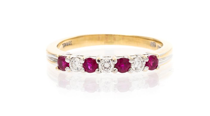 An 18 Karat Yellow Gold, Diamond & Ruby Ring, Tiffany &: An 18 Karat Yellow Gold, Diamond & Ruby Ring, Tiffany & Co. containing three round brilliant diamonds weighing approximately 0.15 carat total and four round brilliant rubies measuring approximately 0.