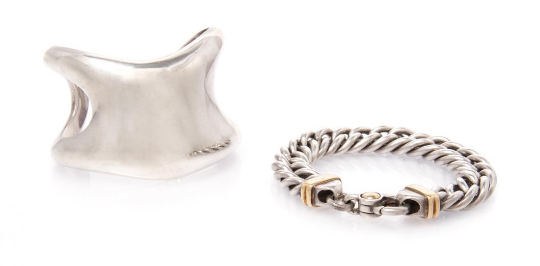 A Collection of Sterling Silver Bracelets, Tiffany &: A Collection of Sterling Silver Bracelets, Tiffany & Co., consisting of a open side cuff bracelet by Elsa Peretti, together with a silver curb link bracelet with 18 karat yellow detail. 64.40 dwts.