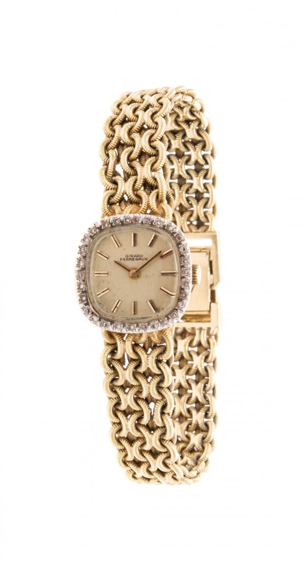 A 14 Karat Yellow Gold and Diamond Wristwatch, Girard: A 14 Karat Yellow Gold and Diamond Wristwatch, Girard Perregaux, 19.00 x 19.00 mm case dimensions, matte gold dial, applied index numerals, gold pencil hands, quartz movement, snap on case box, bezel