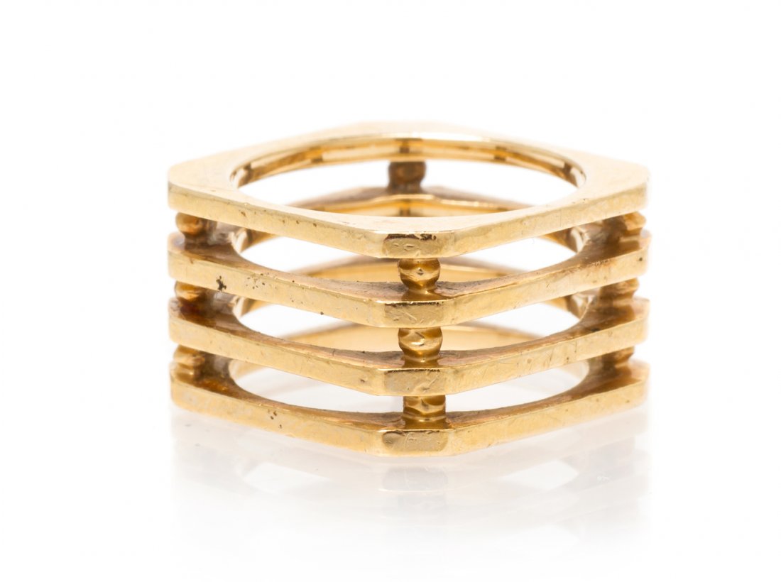 A 14 Karat Yellow Gold Ring, 7.10 dwts.: A 14 Karat Yellow Gold Ring, in a stacked design consisting of four sections separated by beads. Stamp: 14K. 7.10 dwts.