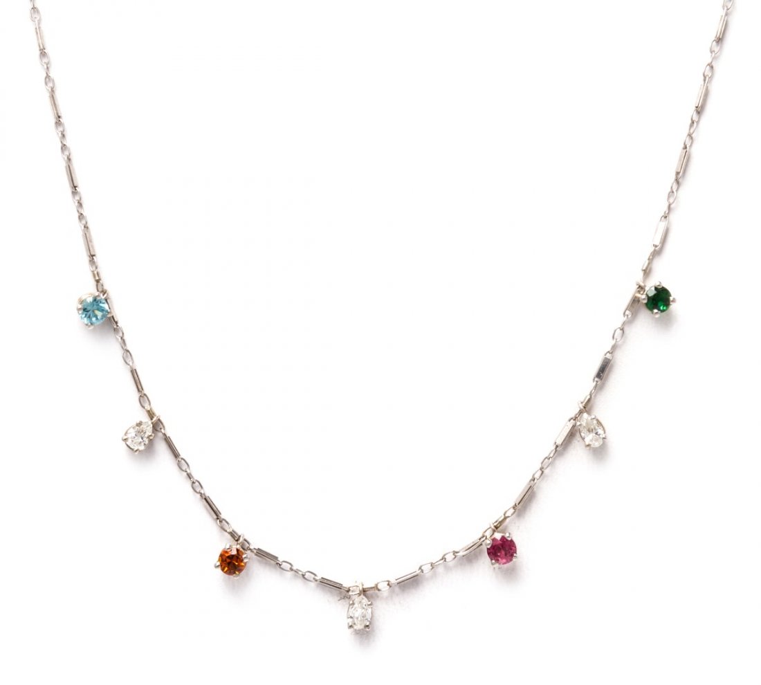 A 14 Karat White Gold, Diamond and Multi Gem Necklace,: A 14 Karat White Gold, Diamond and Multi Gem Necklace, containing three pear shape brilliant cut diamonds weighing approximately 0.60 carat total and four round mixed colored stones including blue zir