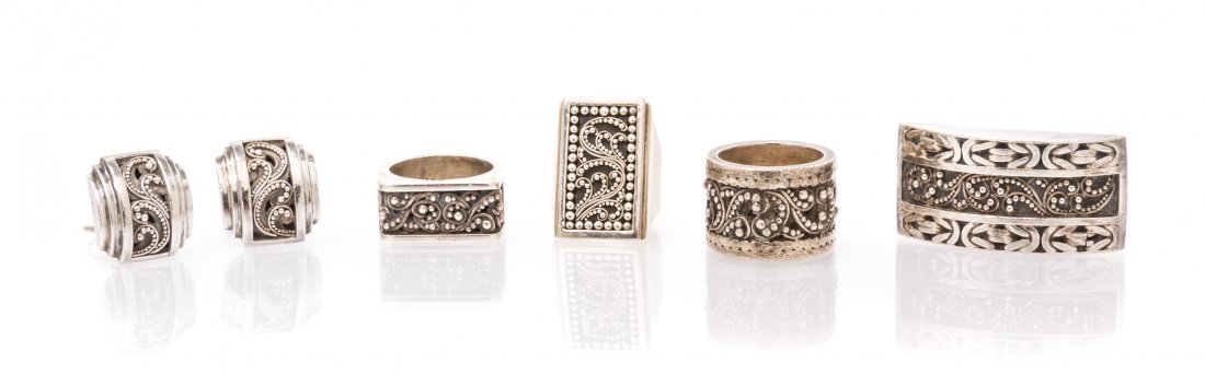 A Collection of Sterling Silver Jewelry, Lois Hill,: A Collection of Sterling Silver Jewelry, Lois Hill, consisting of 3 rings, one brooch and one pair of earrings with applied Arabesque designs. Stamp: 925 Lois Hill. 50.00 dwts.