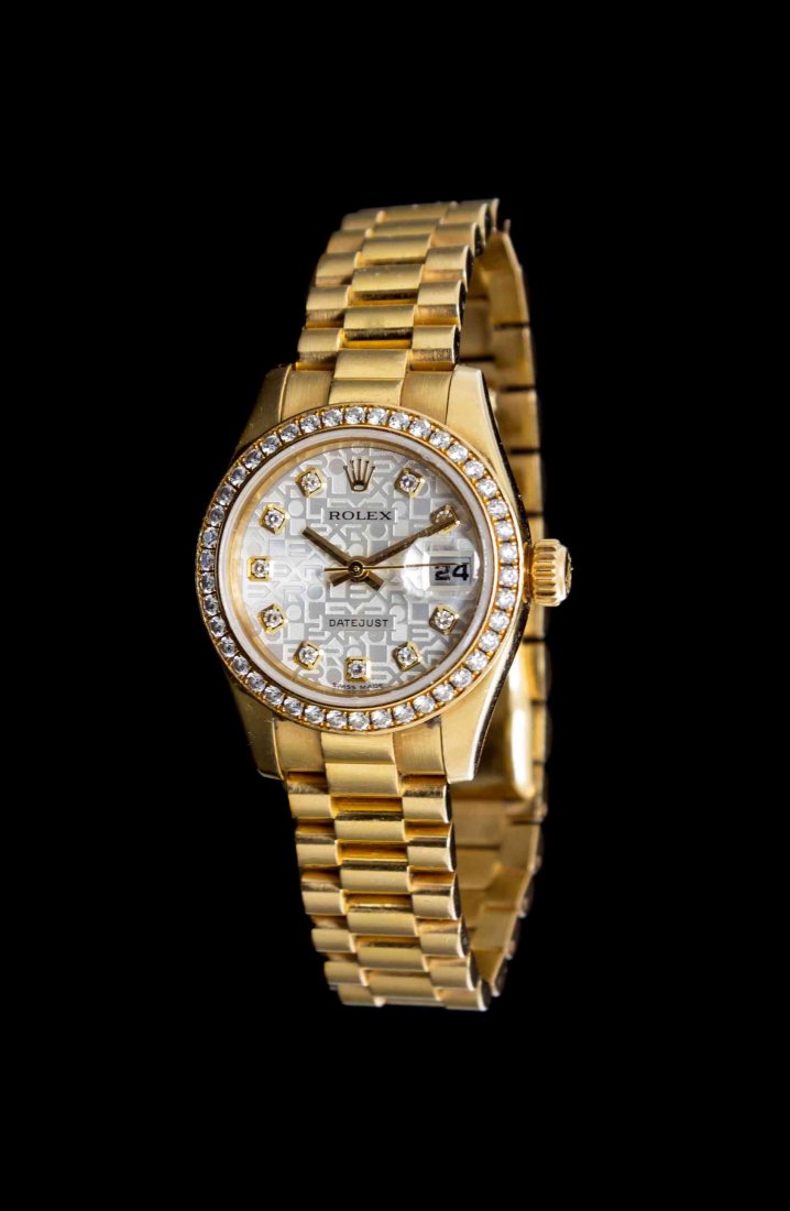 An 18 Karat Yellow Gold and Diamond Ref. 179138: An 18 Karat Yellow Gold and Diamond Ref. 179138 Datejust Wristwatch, Rolex, Circa 2001, bezel containing 42 round brilliant cut diamonds, 26.00 mm case diameter, Silver Jubilee dial, applied gold crow
