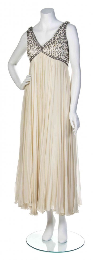 A Seaton Enterprises Ltd. Cream Silk and Beaded Evening: A Seaton Enterprises Ltd. Cream Silk and Beaded Evening Ensemble, circa 1955, sleeveless dress with a pearl and rhinestone beaded bodice, cream beaded coat with a mink collar and cuffs. Labeled: Seato