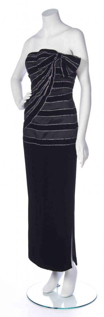 A Murray Arbeid Black Velvet and Rhinestone Strapless: A Murray Arbeid Black Velvet and Rhinestone Strapless Evening Gown, rhinestone trimmed strips of velvet wrapping around the bodice, bow detail to neckline. Labeled: Murray Arbeid London/ Neiman Marcus