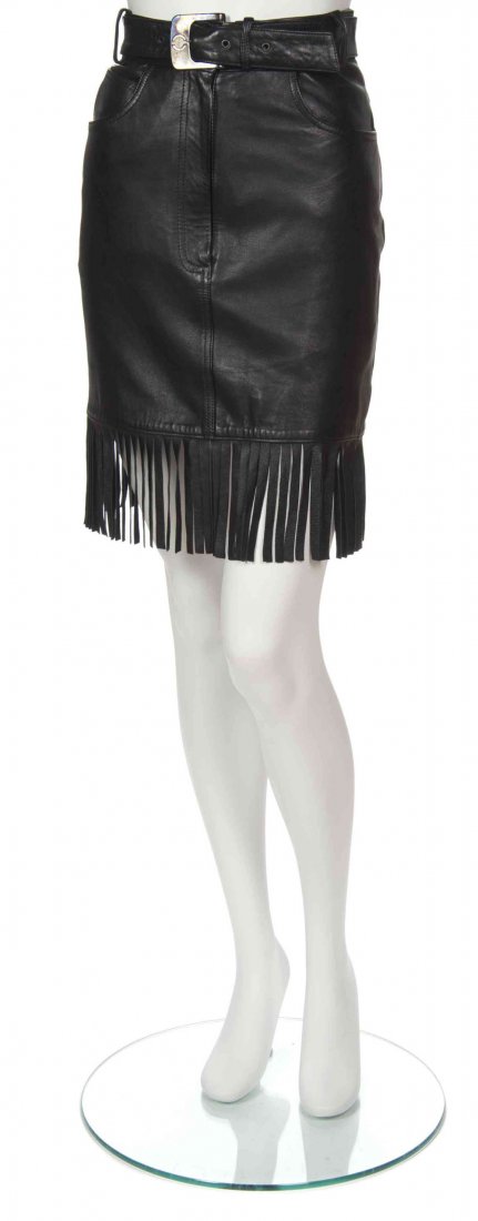 A Claude Montana Black Leather Skirt, Size 36.: A Claude Montana Black Leather Skirt, belted waist with fringe hem. Labeled: State of Claude Montana. Size 36.